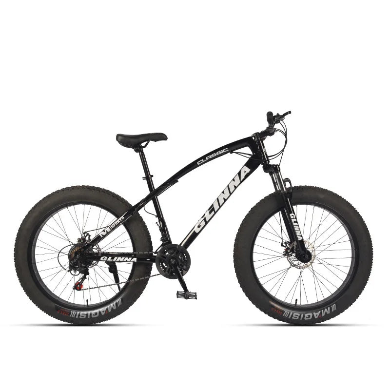A black GINNA CLIMBERS fat tire mountain bike with Magellan tires, shown from a side profile on a clean white background.